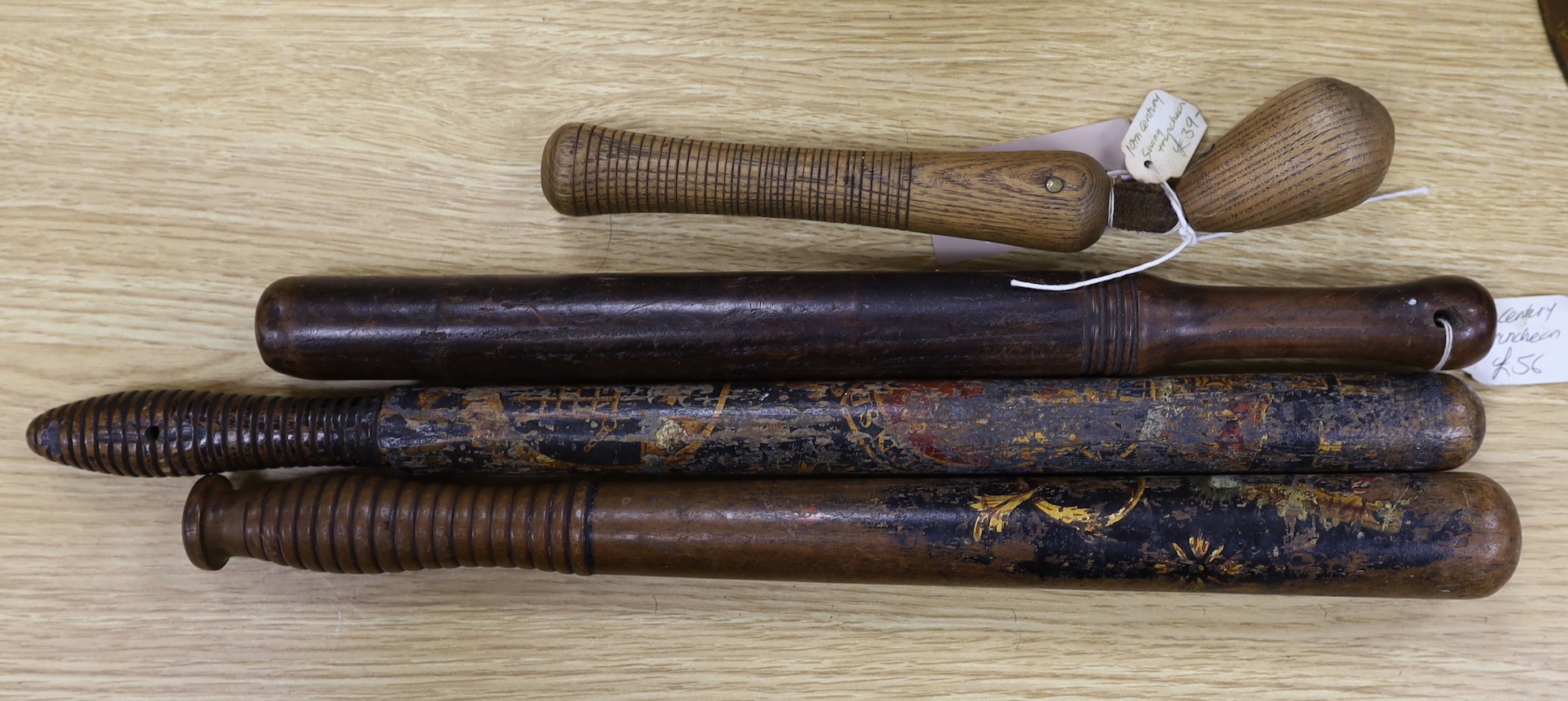 Four 19th century treen truncheons, longest 46cm